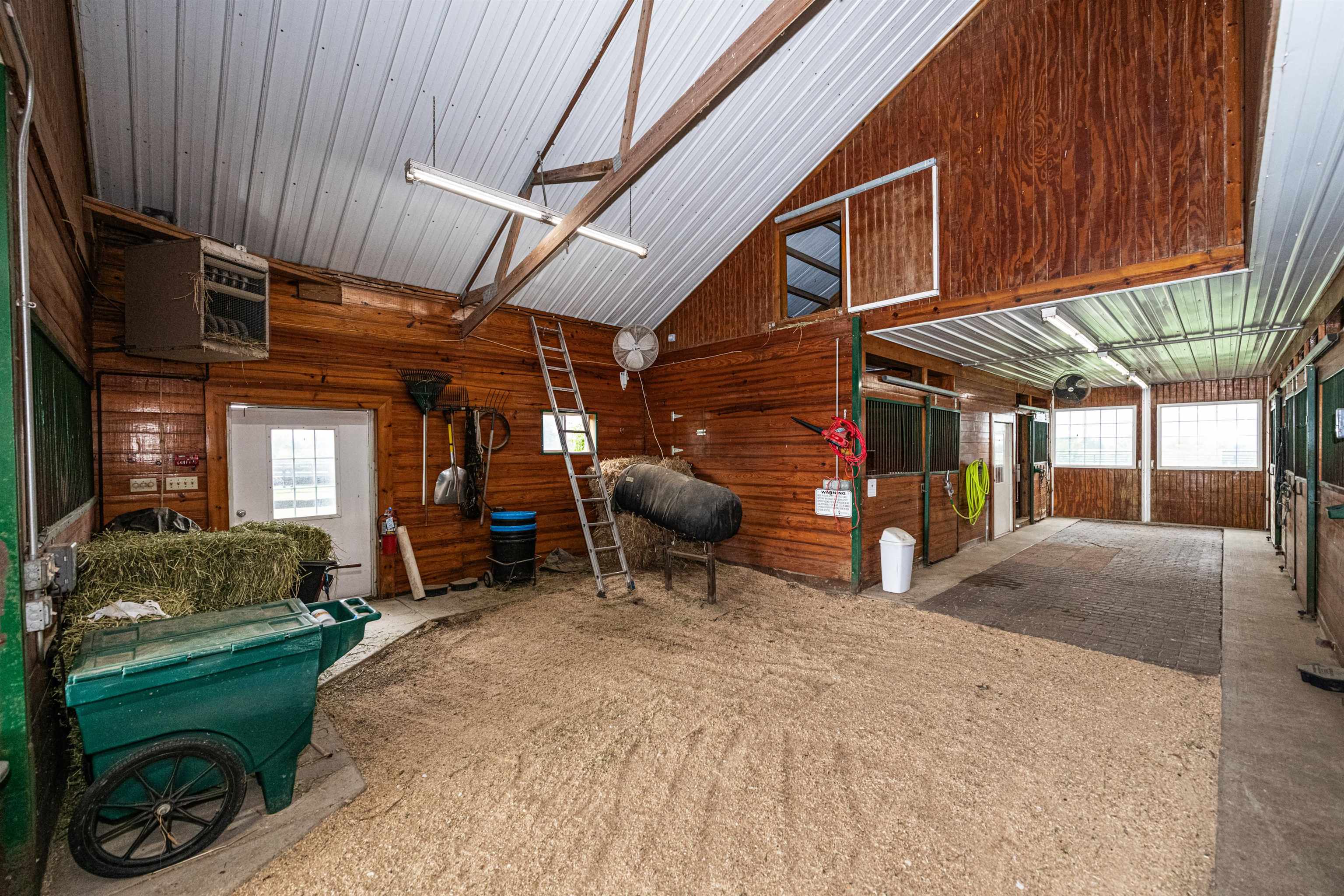 6715 Meyer Road Marengo, IL 60152 - Photo 39 of 72 a view of a porch with furniture and a garage