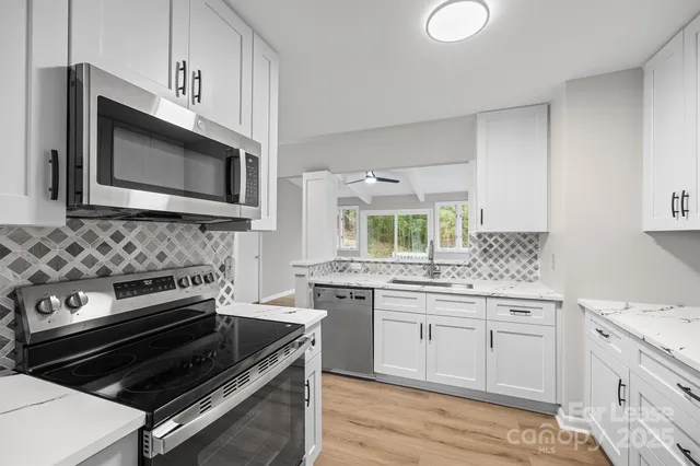 a kitchen with a stove and a microwave