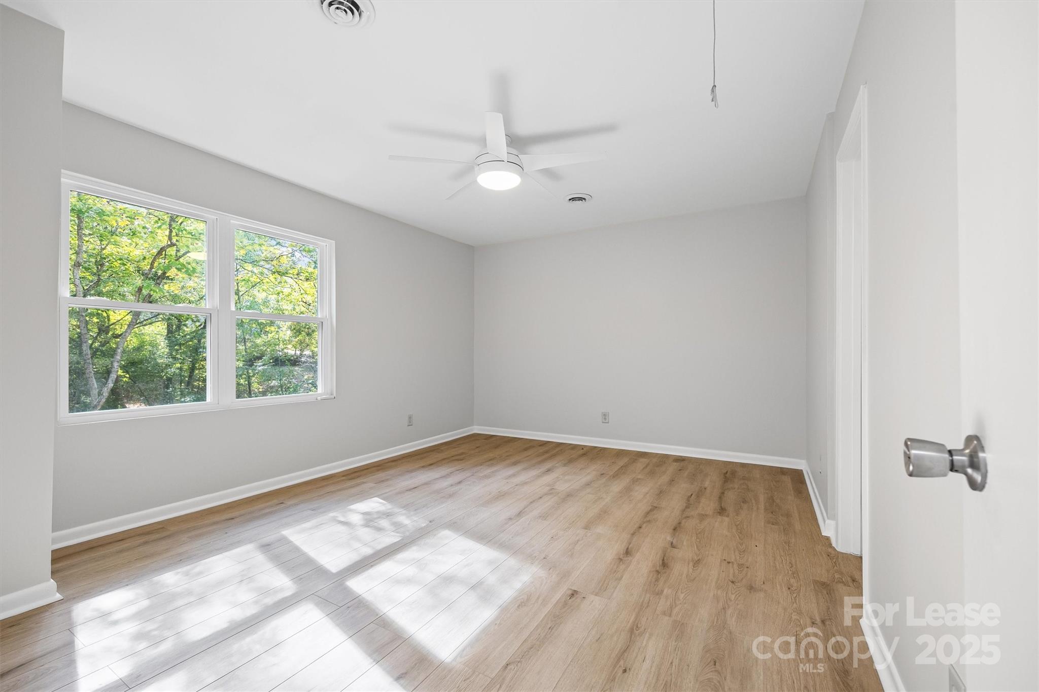 6012 Lanai Lane Fort Mill, SC 29708 - Photo 20 of 32 wooden floor in an empty room with a window