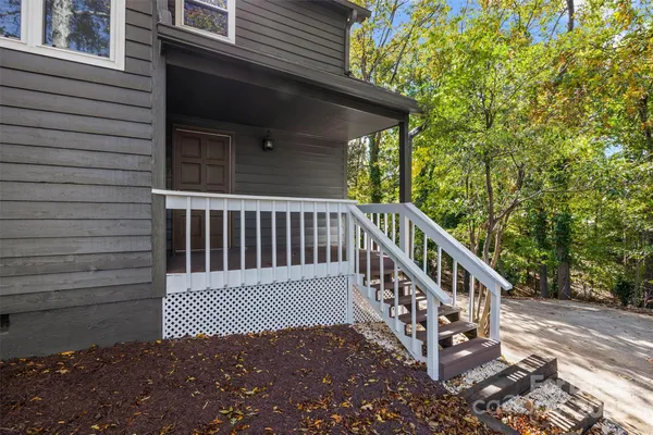 a view of a wooden deck with a fence
