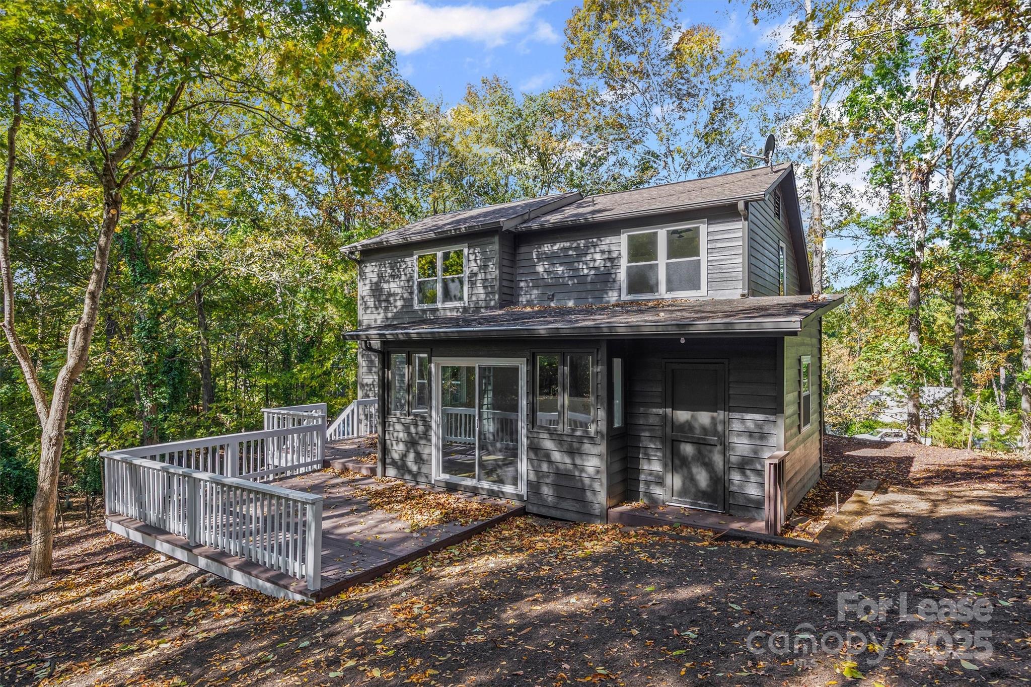 6012 Lanai Lane Fort Mill, SC 29708 - Photo 28 of 32 a view of a house with a small deck and a floor to ceiling window