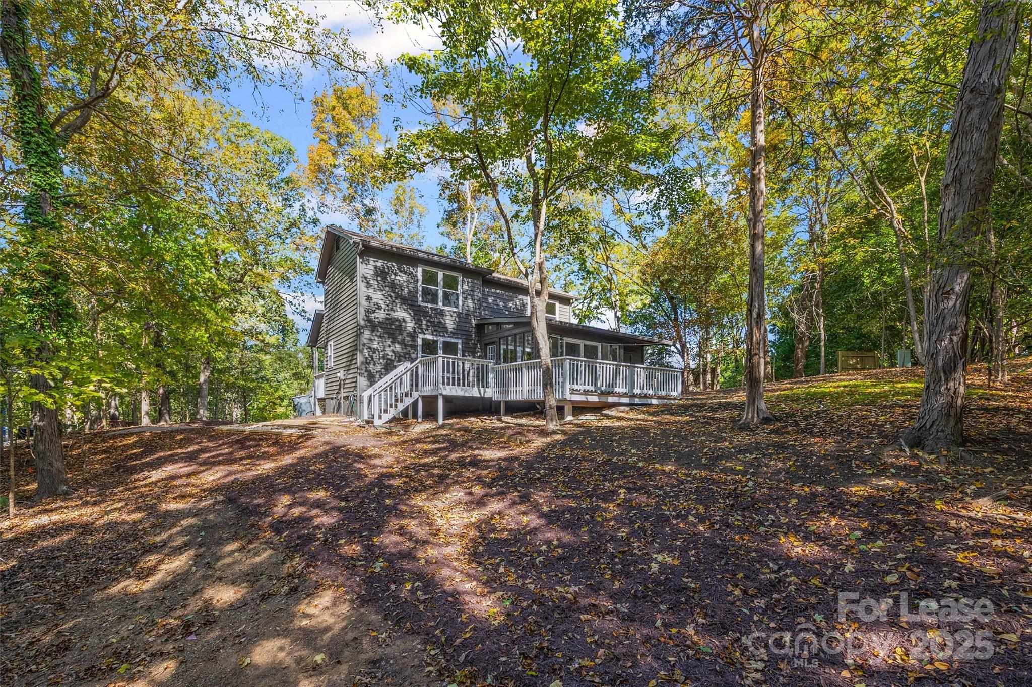 6012 Lanai Lane Fort Mill, SC 29708 - Photo 29 of 32 a backyard of a house with lots of green space