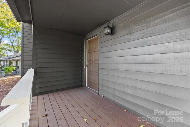 a view of outdoor space and wooden floor