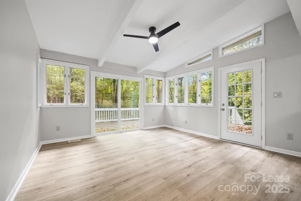 a view of an empty room with a window