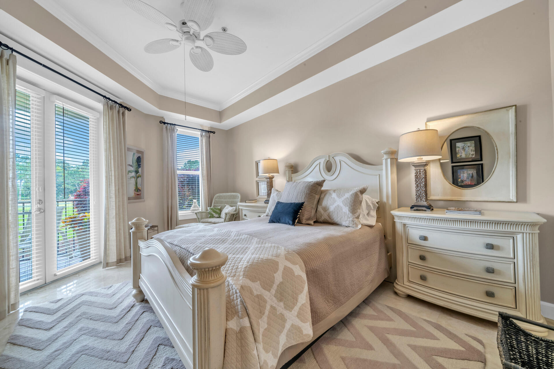 5357 Pine Ridge Lane, Unit 5357 Miramar Beach, FL 32550 - Photo 25 of 53 a bedroom with a large bed and a chandelier