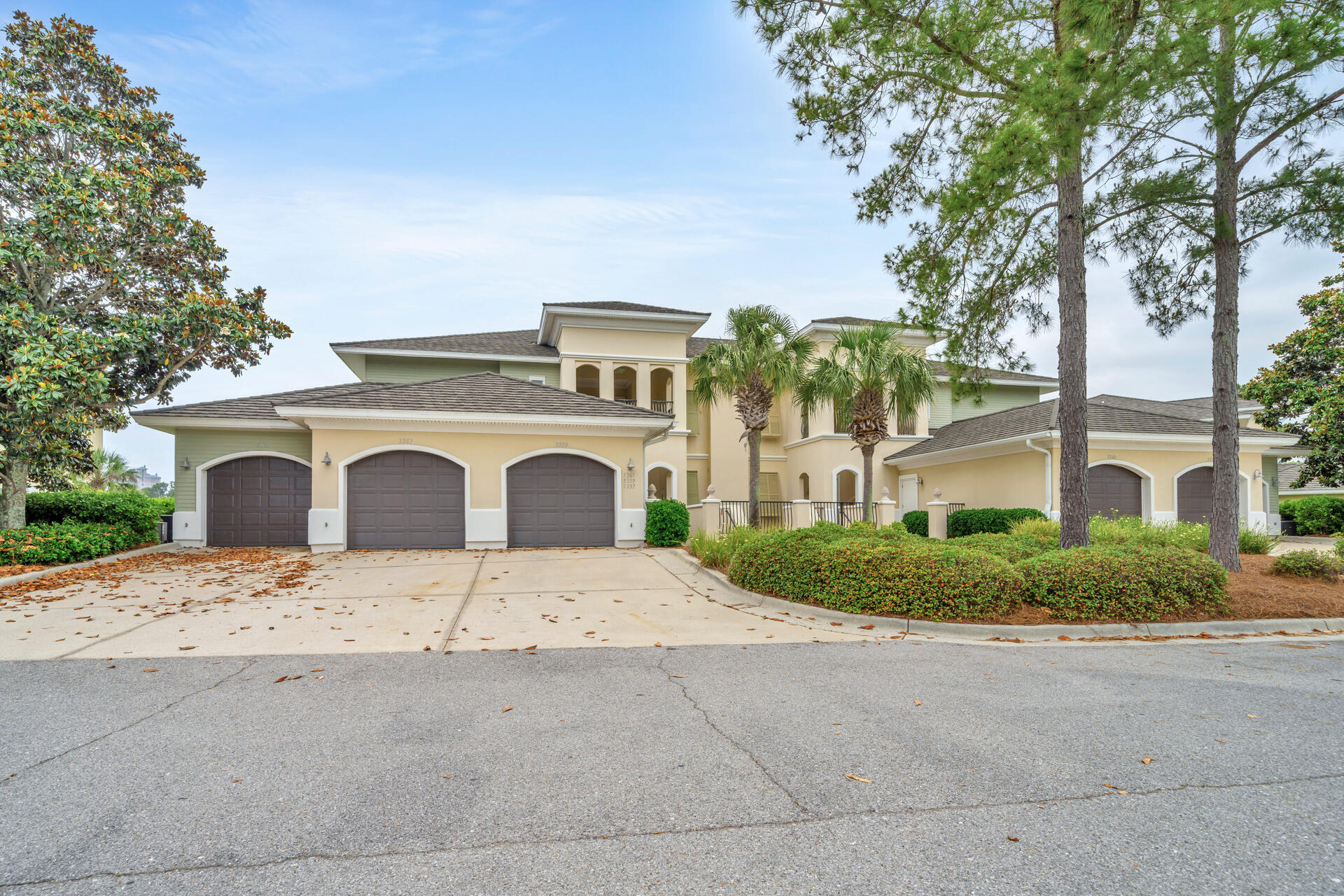 5357 Pine Ridge Lane, Unit 5357 Miramar Beach, FL 32550 - Photo 42 of 53 a front view of a house with yard and garage