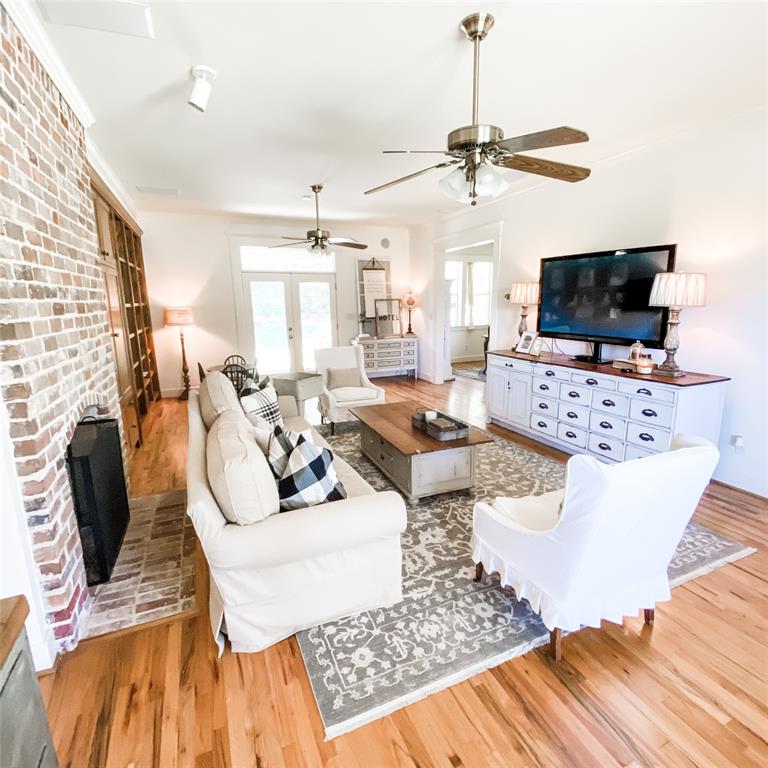 581 Country Club Road Fairview, TX 75069 - Photo 21 of 39 a living room with furniture and a flat screen tv