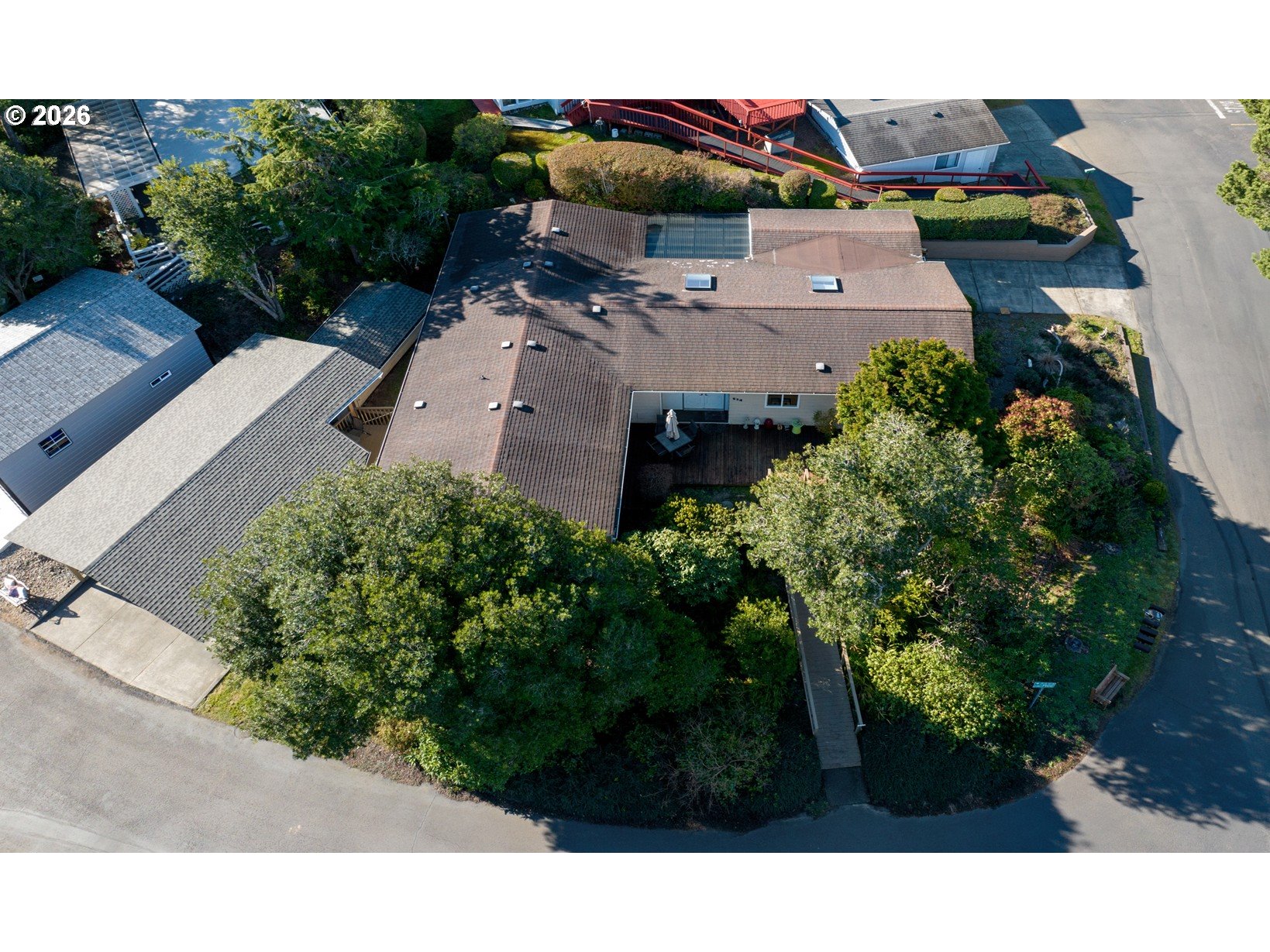 an aerial view of a house with a garden