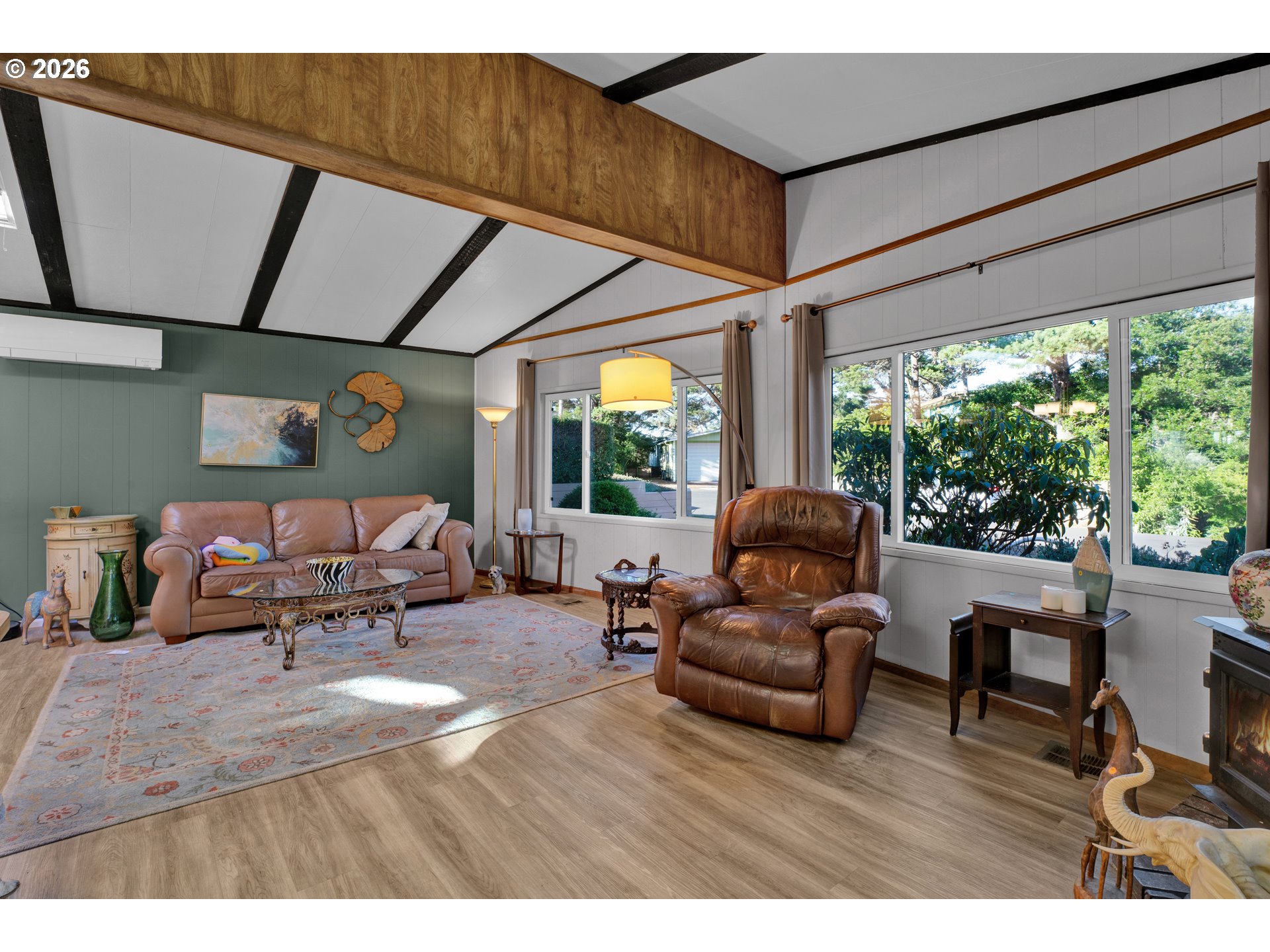 1601 Rhododendron Drive, Unit 534 Florence, OR 97439 - Photo 13 of 48 a living room with furniture and a large window