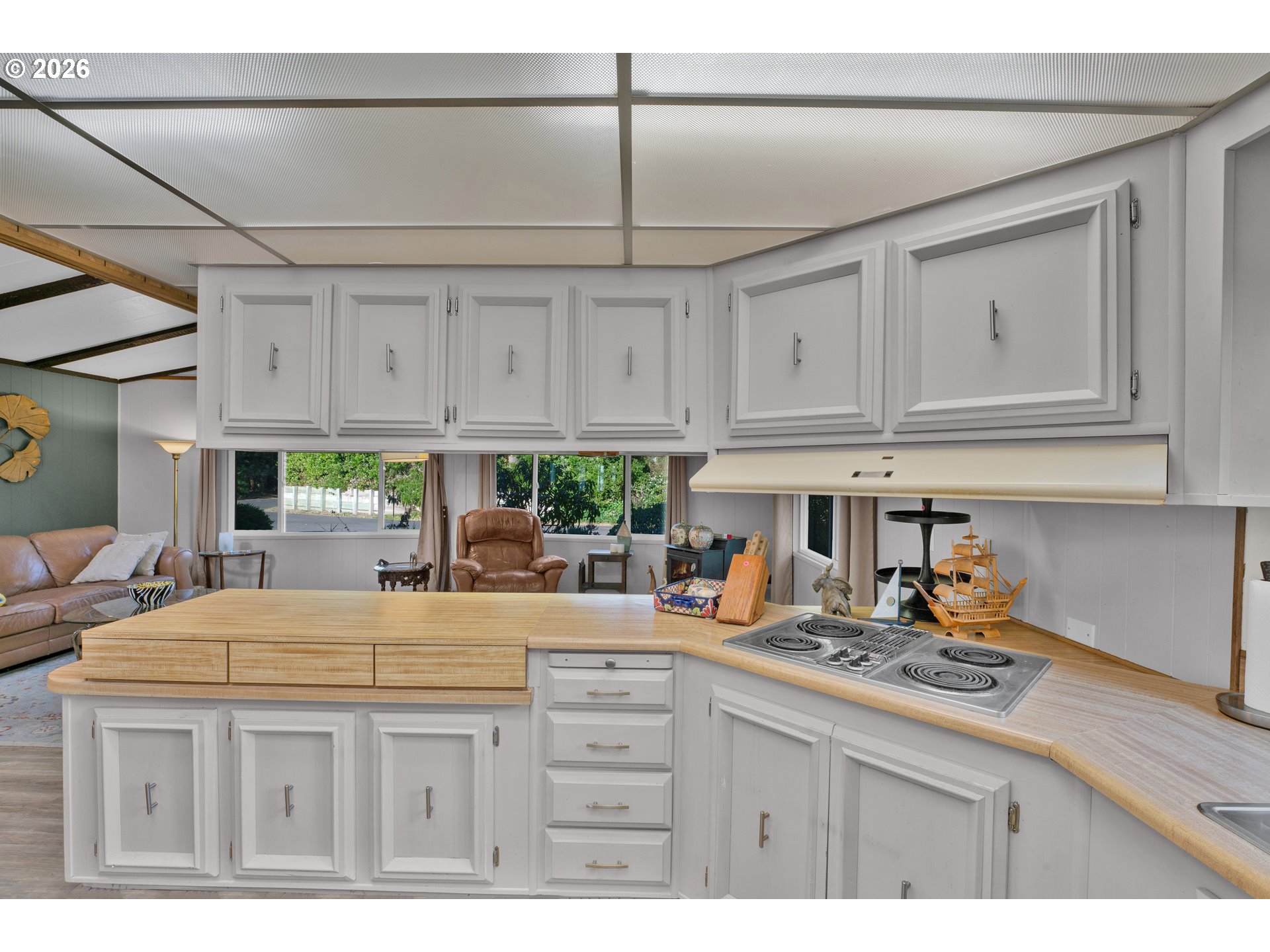 1601 Rhododendron Drive, Unit 534 Florence, OR 97439 - Photo 18 of 48 a kitchen with stainless steel appliances kitchen island granite countertop a sink and cabinets