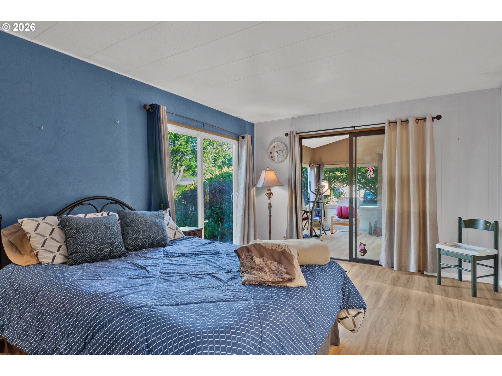 1601 Rhododendron Drive, Unit 534 Florence, OR 97439 - Photo 30 of 48 a bedroom with a bed and wooden floor