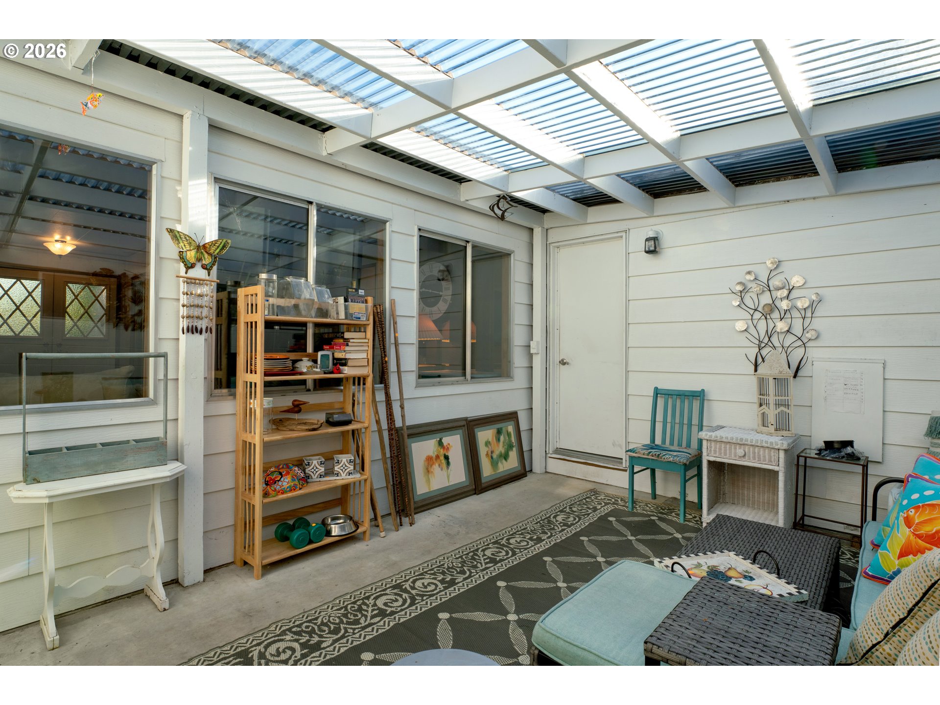 1601 Rhododendron Drive, Unit 534 Florence, OR 97439 - Photo 37 of 48 a living room with furniture and a flat screen tv
