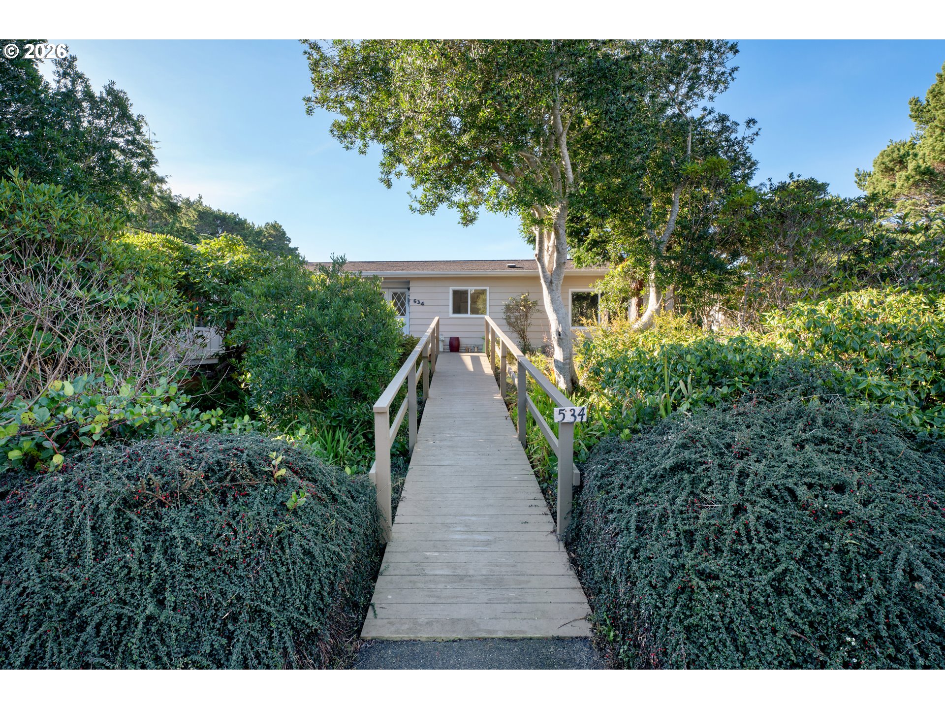 1601 Rhododendron Drive, Unit 534 Florence, OR 97439 - Photo 40 of 48 a view of an house with backyard