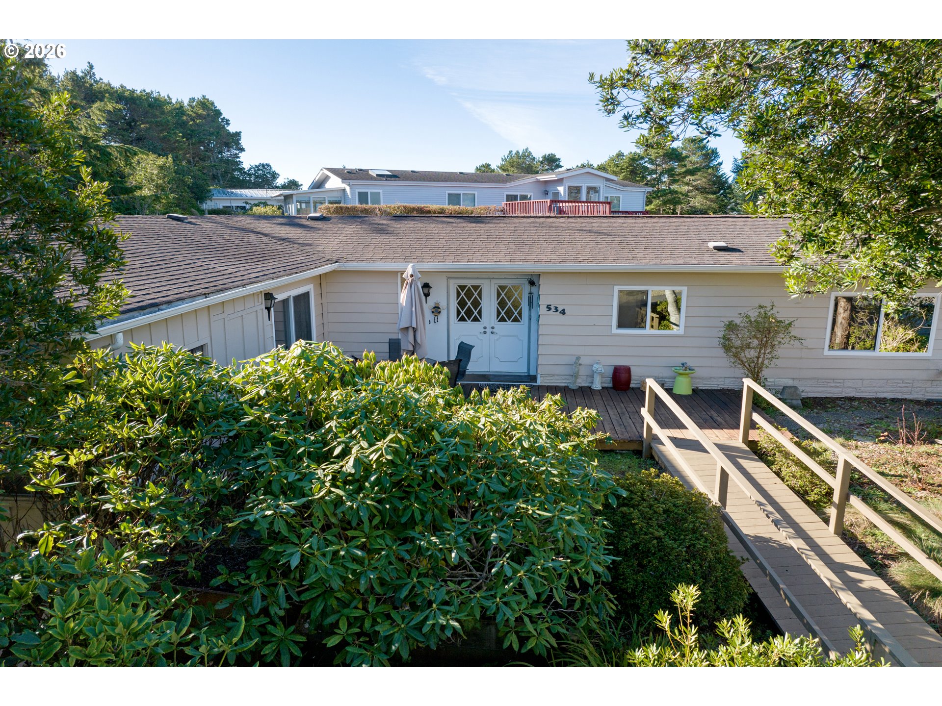 1601 Rhododendron Drive, Unit 534 Florence, OR 97439 - Photo 4 of 48 aerial view of a house with a yard