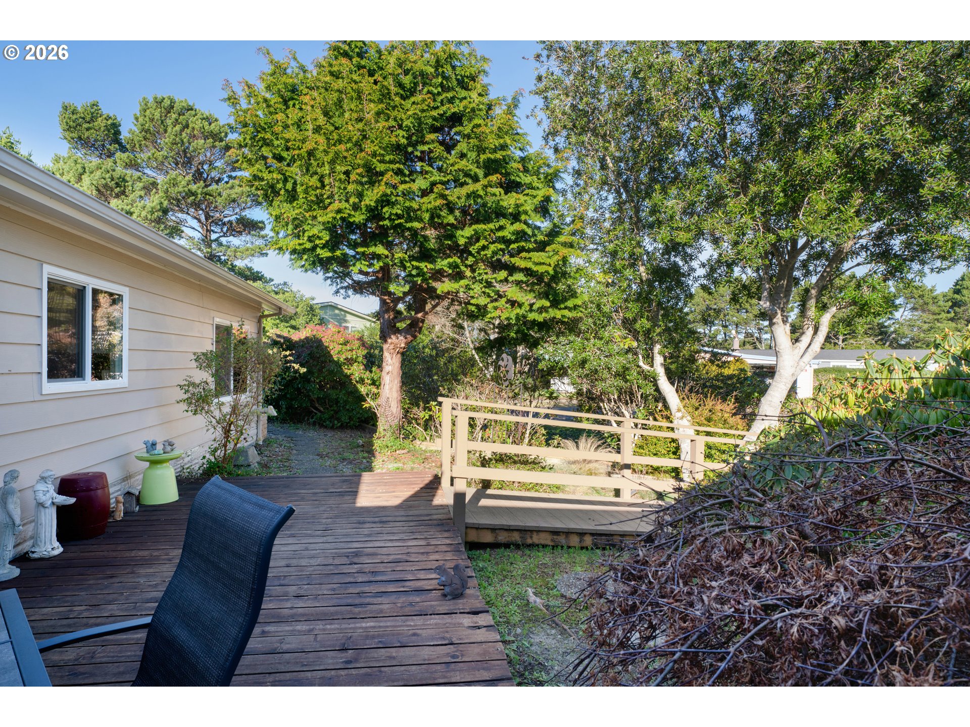 1601 Rhododendron Drive, Unit 534 Florence, OR 97439 - Photo 43 of 48 a view of house with backyard and sitting area