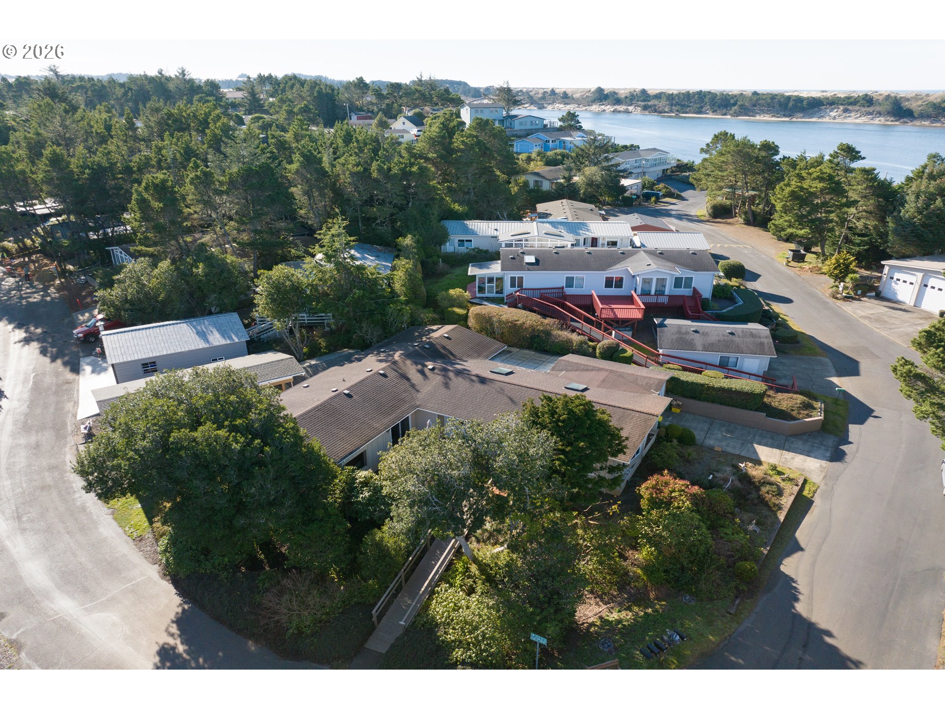 1601 Rhododendron Drive, Unit 534 Florence, OR 97439 - Photo 44 of 48 a view of a house with a garden
