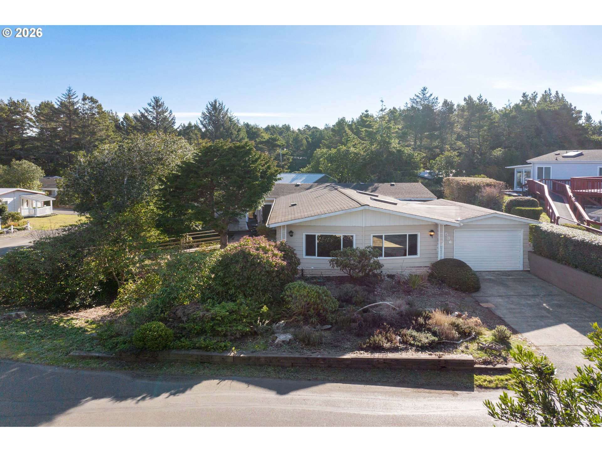 1601 Rhododendron Drive, Unit 534 Florence, OR 97439 - Photo 5 of 48 a aerial view of a house with a yard