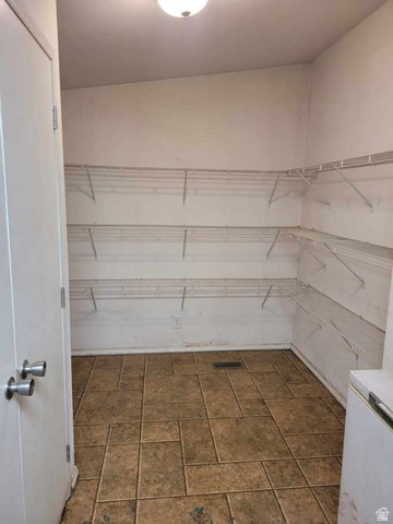 240 Horseshoe Bend Road Vernal, UT 84078 - Photo 21 of 41 Spacious pantry featuring extensive wire shelving, a flush mount ceiling light, and durable tile flooring