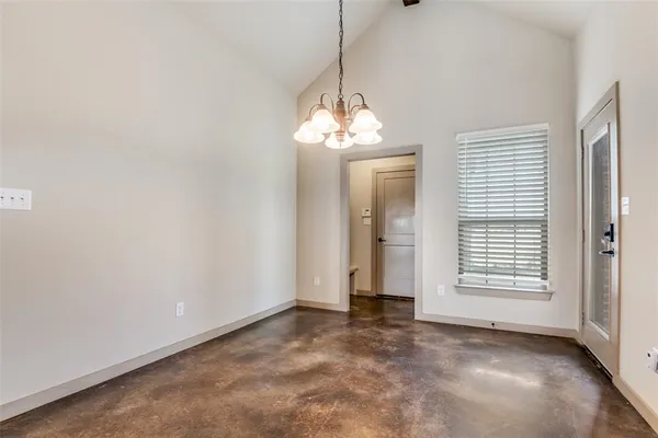 a view of a room with window and stairs