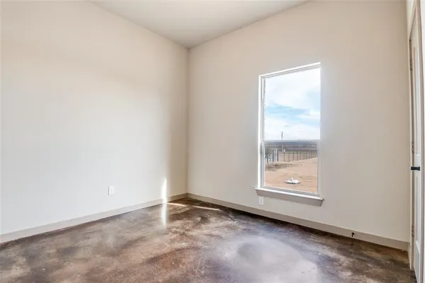 an empty room with windows