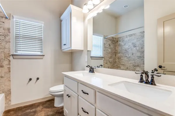 a bathroom with a sink and a toilet