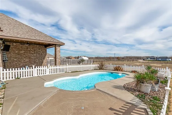 a view of a swimming pool with a garden
