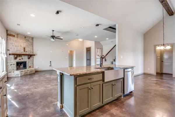 a kitchen with a sink and a refrigerator
