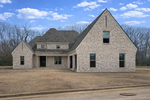 a front view of a house with garage