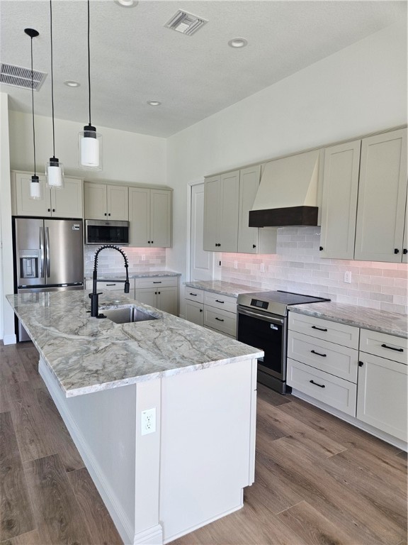 961 George Street Sebastian, FL 32958 - Photo 3 of 18 a kitchen with stainless steel appliances granite countertop a sink a stove and a refrigerator
