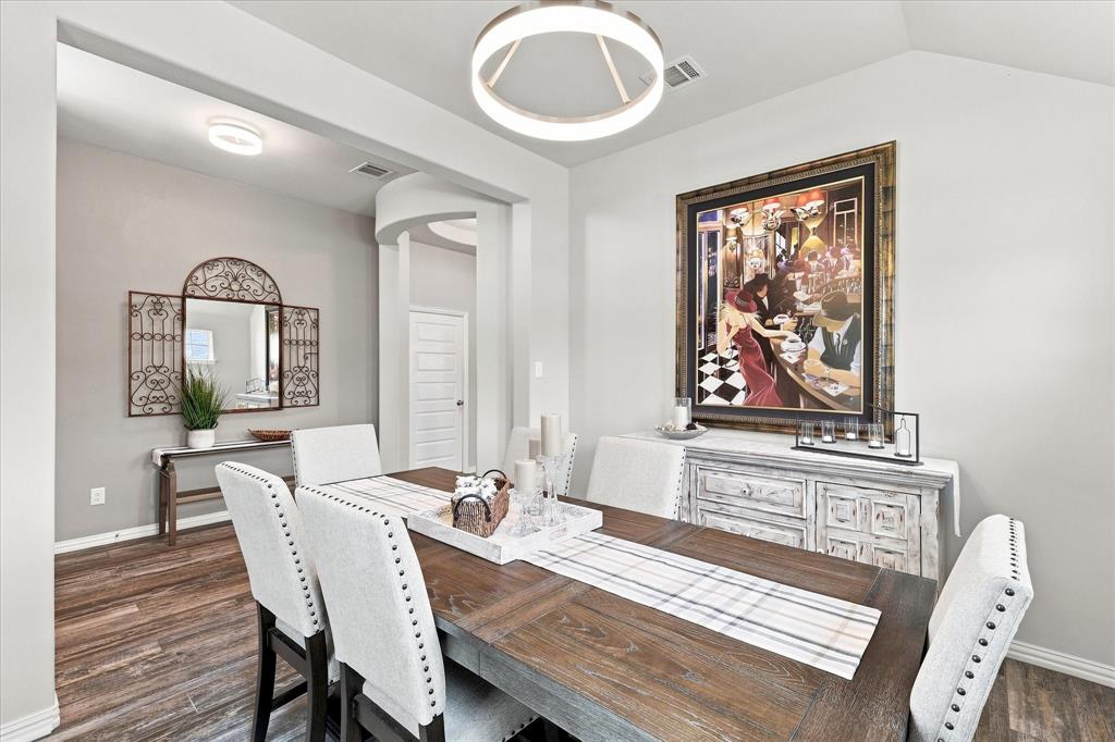 15729 Preble Road Fort Worth, TX 76177 - Photo 9 of 37 Formal Dining Room features a Vaulted Ceiling, Contemporary Designer Lighting, Upgraded Wood-look Tile Flooring and Abundant Natural Light. The Open Design and Architectural Details create an Impressive Space for Entertaining.