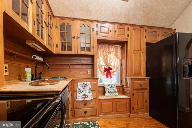 a kitchen with stainless steel appliances granite countertop a stove and a refrigerator