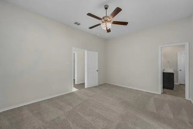 a bathroom with a shower and a sink