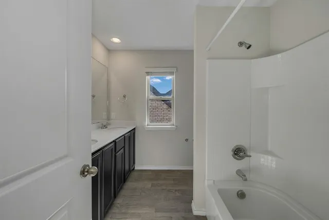a view of a porch with a small yard and wooden fence