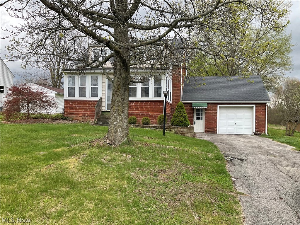 3475 South Turner Road Canfield, OH 44406 - Photo 2 of 33 View of front of property with a garage and a front yard