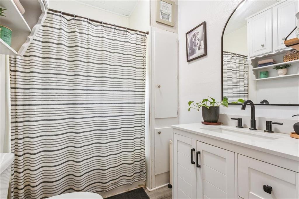 102 Brookshire Street Riesel, TX 76682 - Photo 16 of 24 a bathroom with a sink and a mirror