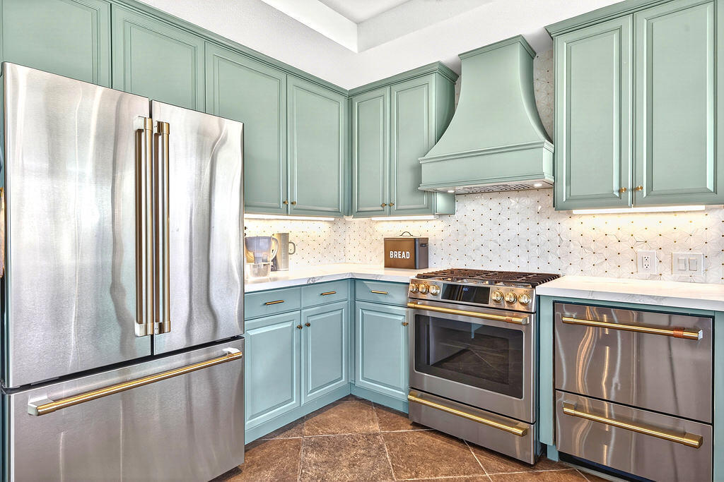 10 Colonial Drive Rancho Mirage, CA 92270 - Photo 11 of 25 a kitchen with a stove refrigerator and sink