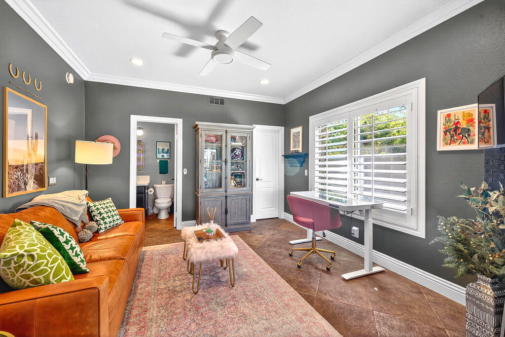 10 Colonial Drive Rancho Mirage, CA 92270 - Photo 13 of 25 a living room with patio furniture and a potted plant