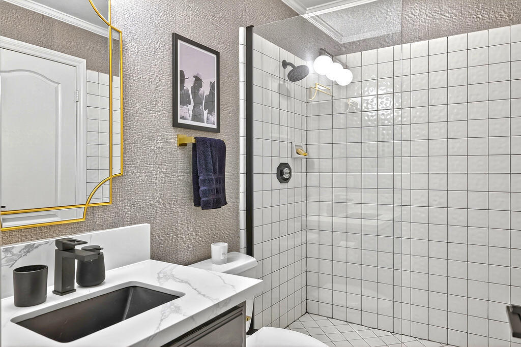 10 Colonial Drive Rancho Mirage, CA 92270 - Photo 14 of 25 a bathroom with a sink a toilet and shower