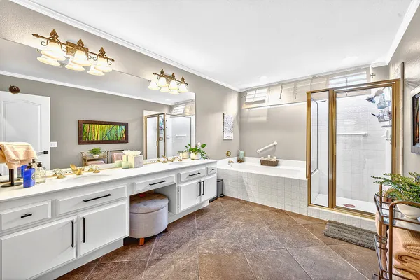 a large white kitchen with a large window