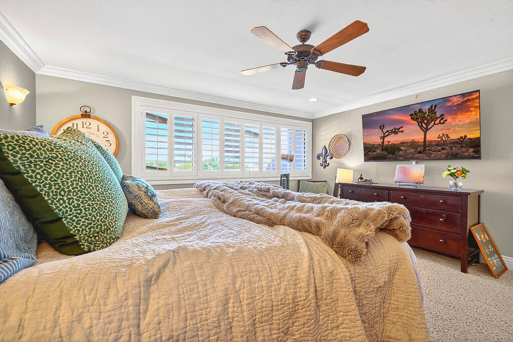 10 Colonial Drive Rancho Mirage, CA 92270 - Photo 20 of 25 a bedroom with a bed and window