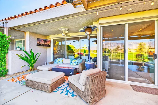 a outdoor living space with furniture and garden view