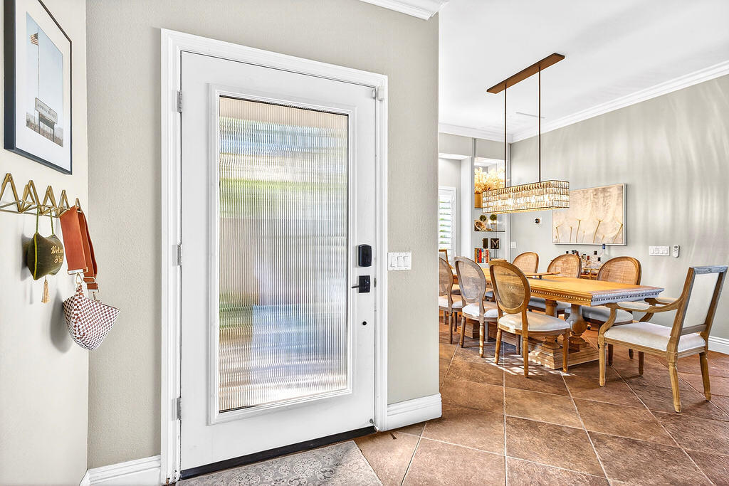 10 Colonial Drive Rancho Mirage, CA 92270 - Photo 7 of 25 a dining room with furniture and a chandelier