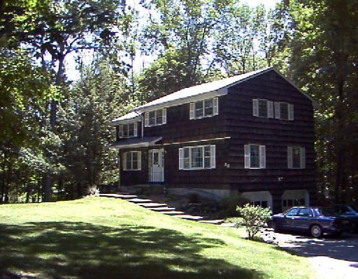 20 Bennetts Farm Road Ridgefield, CT 06877 - Photo 1 of 1 a front view of a house with a yard