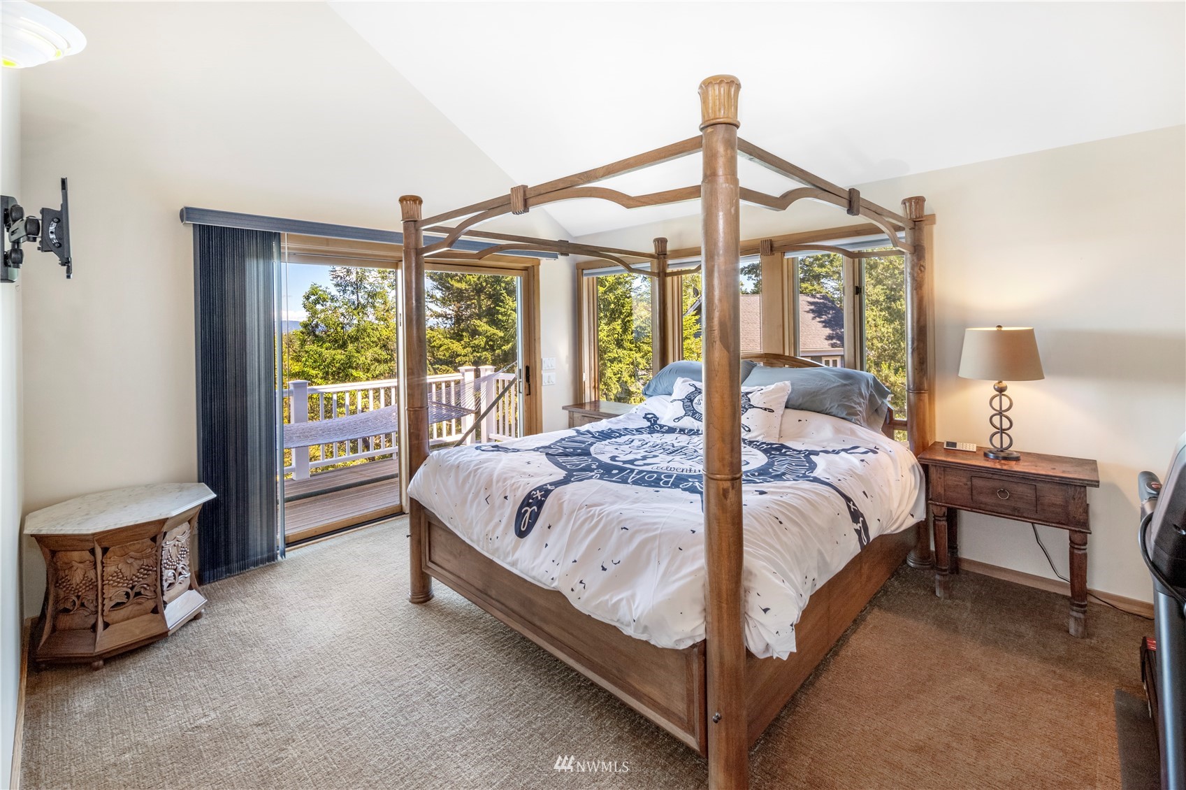 338 Sunrise Ridge Road San Juan Island, WA 98250 - Photo 14 of 39 a bed sitting in a bedroom next to a window