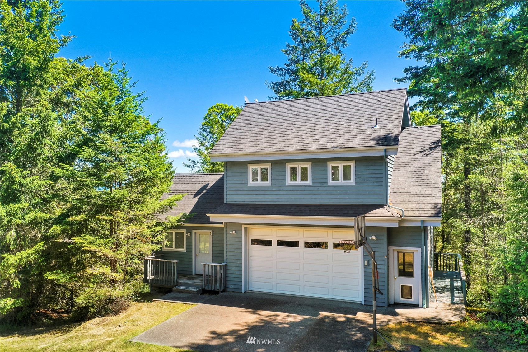 338 Sunrise Ridge Road San Juan Island, WA 98250 - Photo 23 of 39 a front view of a house with a yard