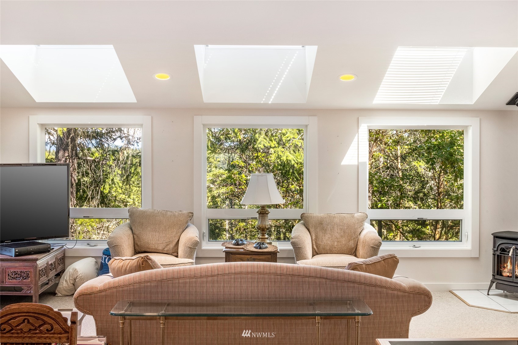 338 Sunrise Ridge Road San Juan Island, WA 98250 - Photo 24 of 39 a bedroom with a bed and large windows