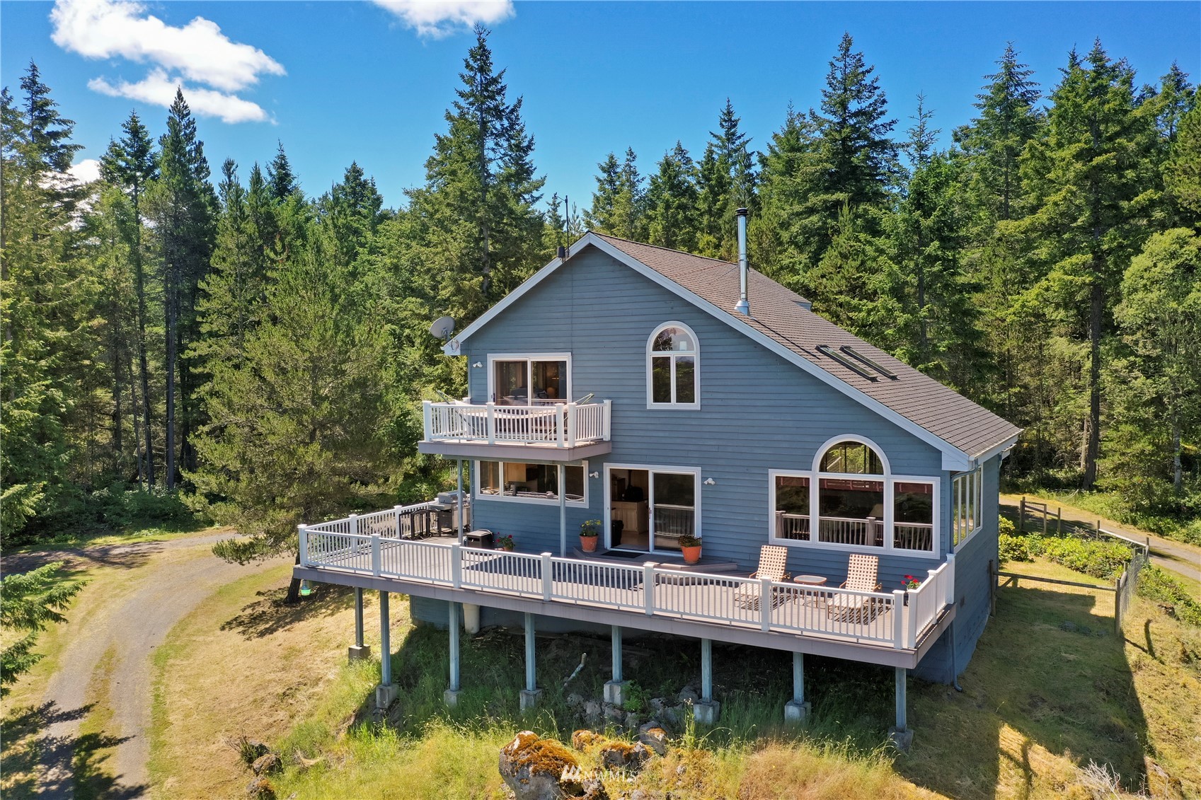 338 Sunrise Ridge Road San Juan Island, WA 98250 - Photo 29 of 39 a view of house with swimming pool and sitting area