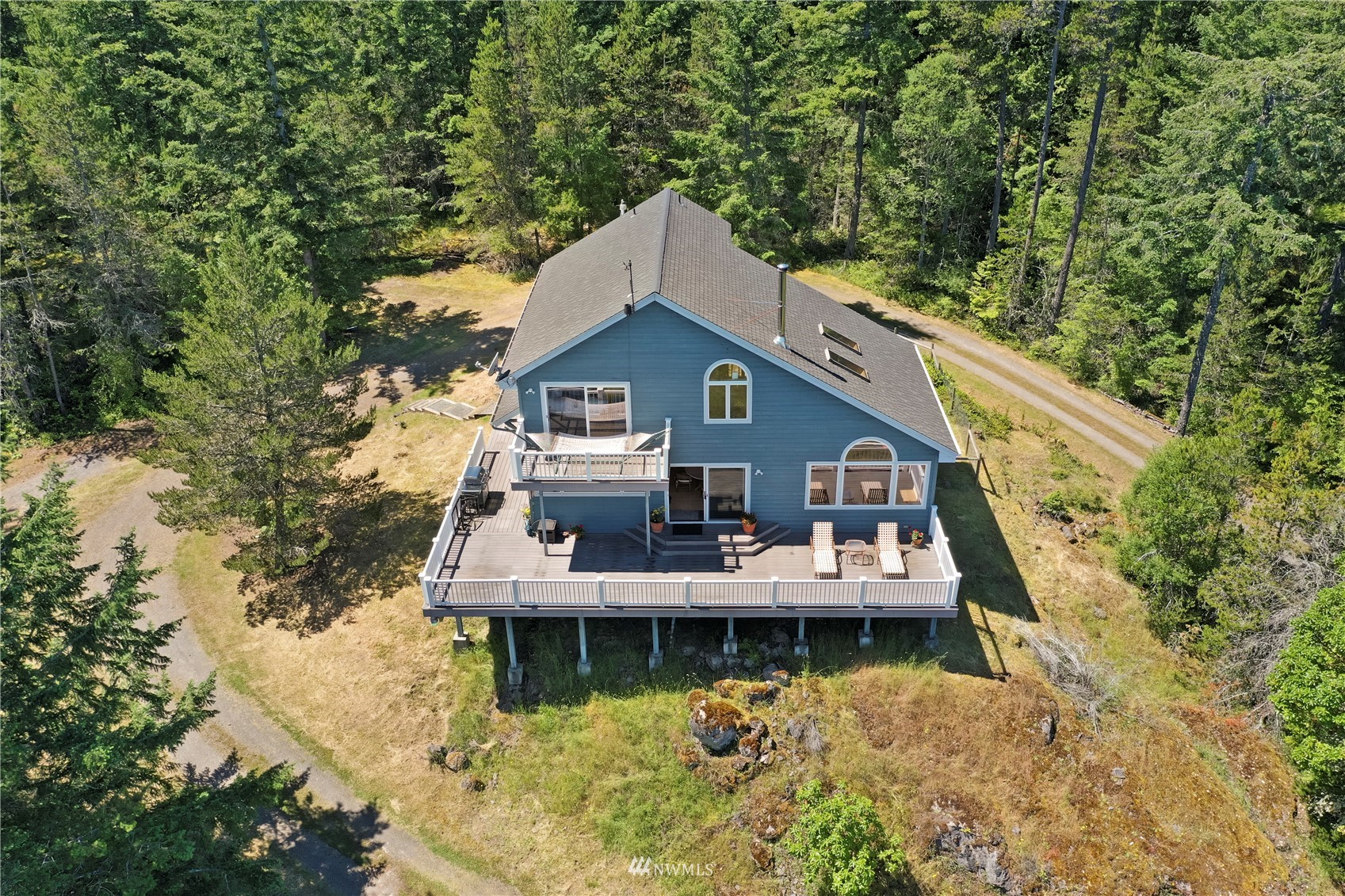 338 Sunrise Ridge Road San Juan Island, WA 98250 - Photo 33 of 39 a aerial view of a house with swimming pool and large trees