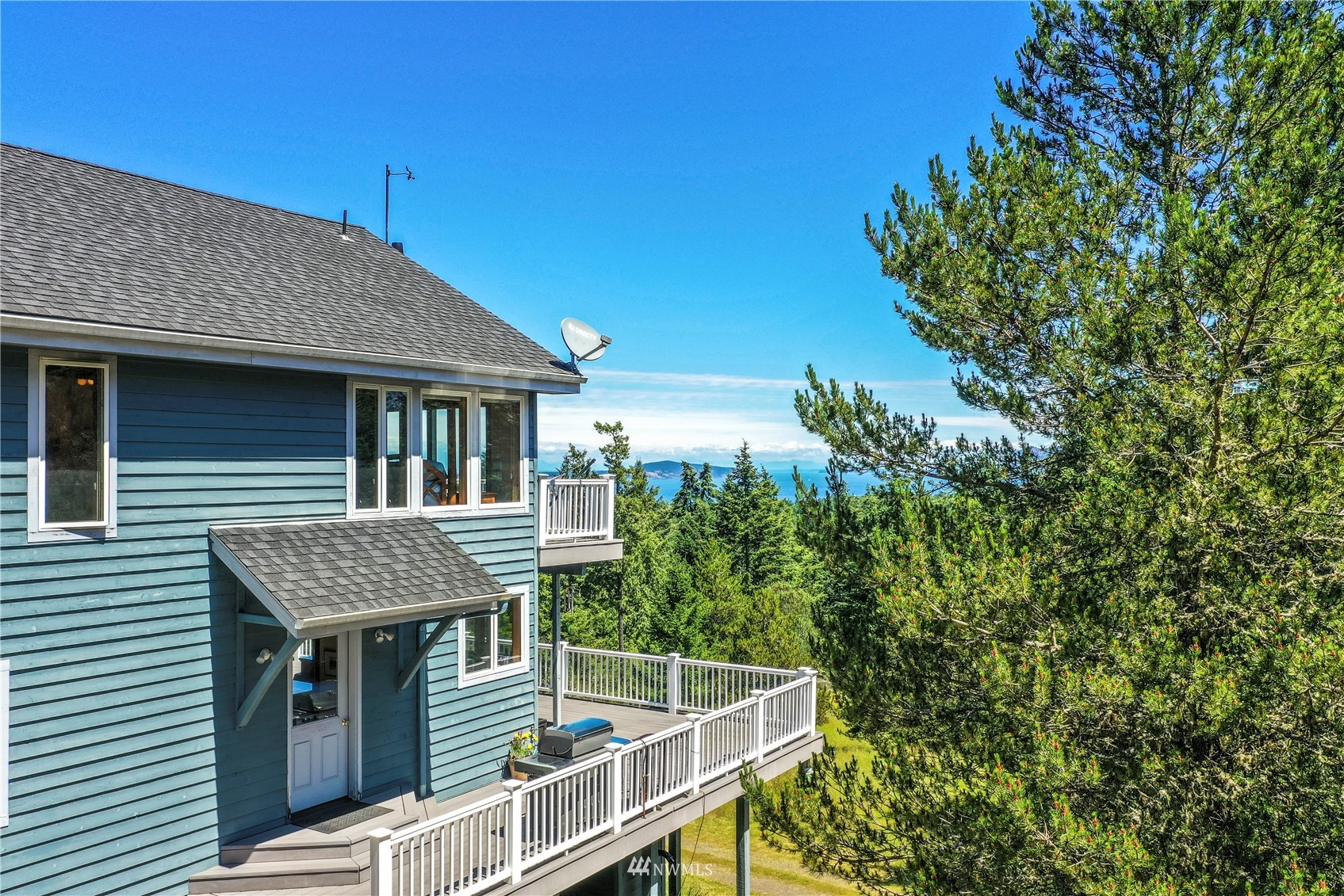 338 Sunrise Ridge Road San Juan Island, WA 98250 - Photo 38 of 39 a view of house with roof deck and seating space