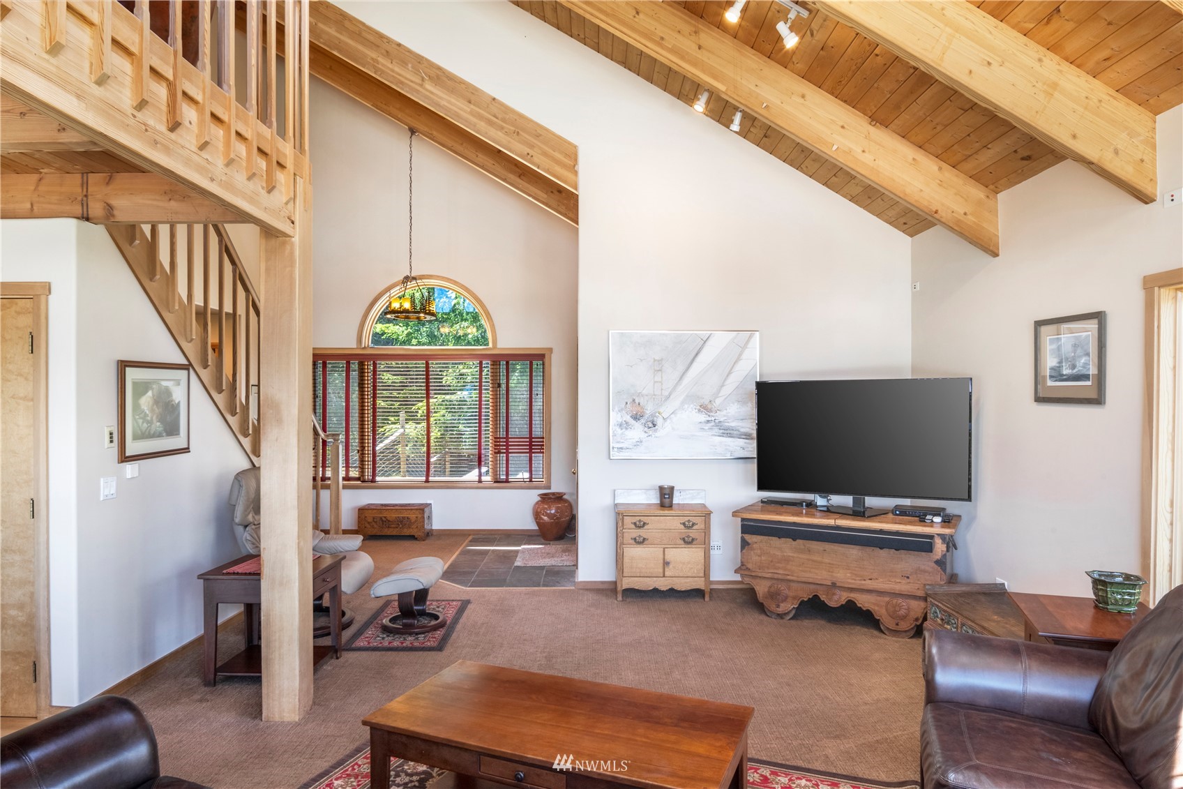 338 Sunrise Ridge Road San Juan Island, WA 98250 - Photo 6 of 39 a living room with furniture and a flat screen tv